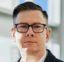 Fotografía de Alexander Hughes, CEO de una compañía dedicada al trading de criptomonedas